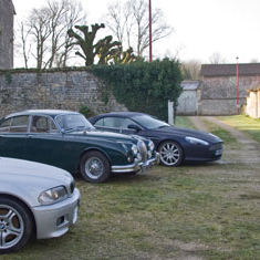 modern and classic cars parked in the courtyard